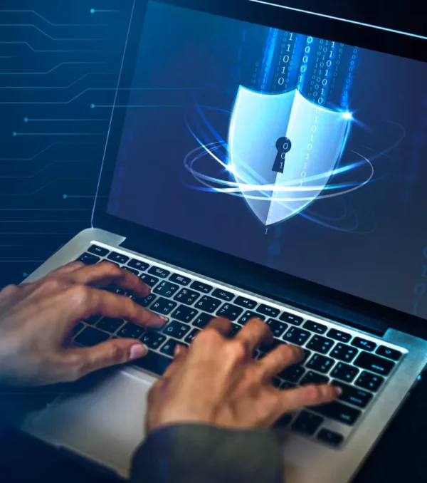Hacker cracking the security code on a laptop